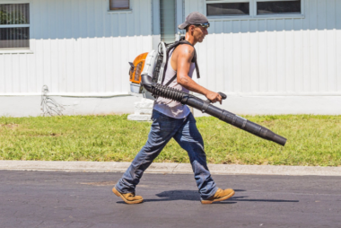 a man holding a blower